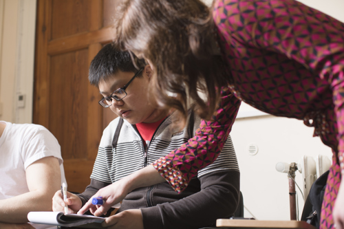 Lecturer helping student